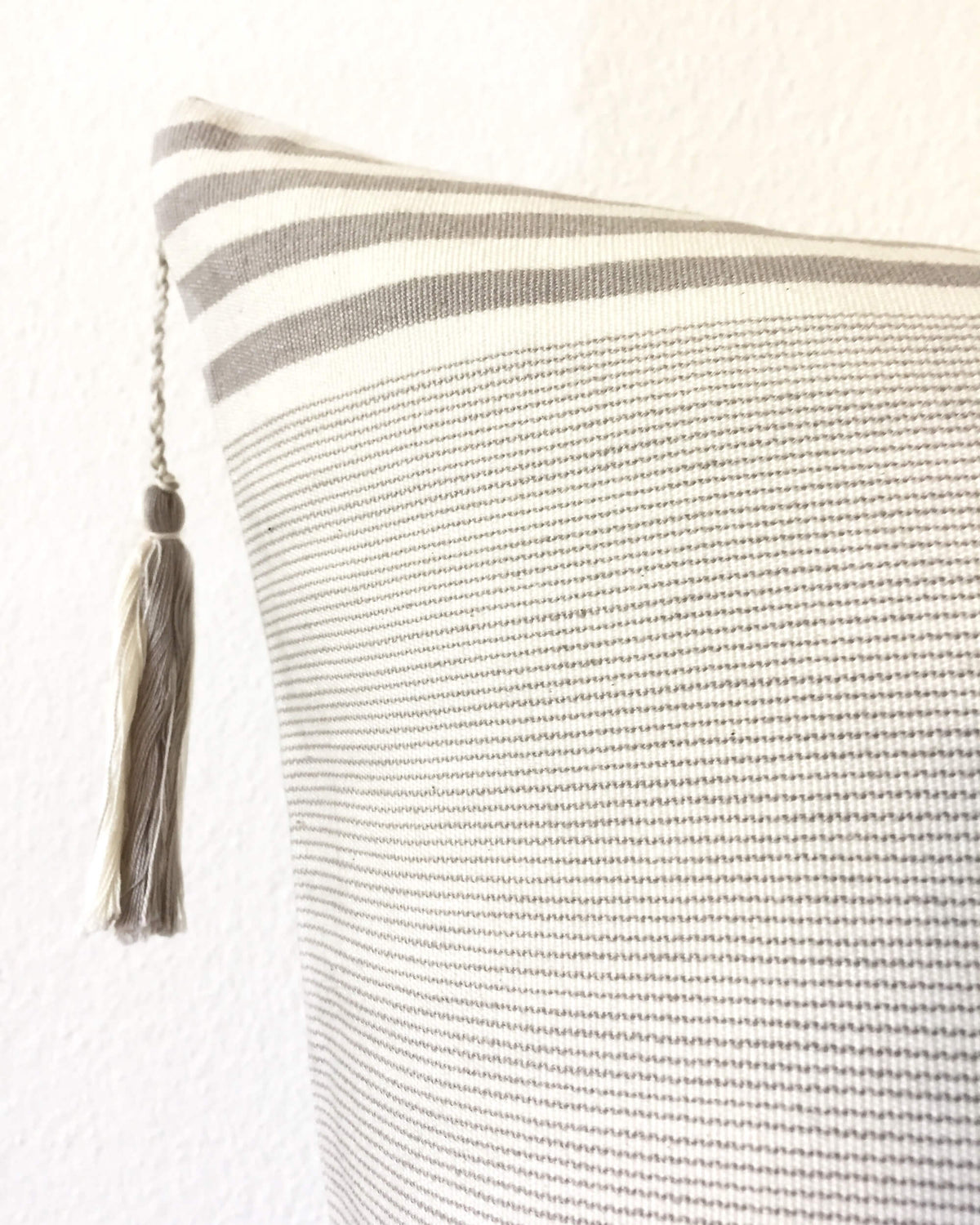 Lupita Hielo Throw Pillow detail view of tassel 