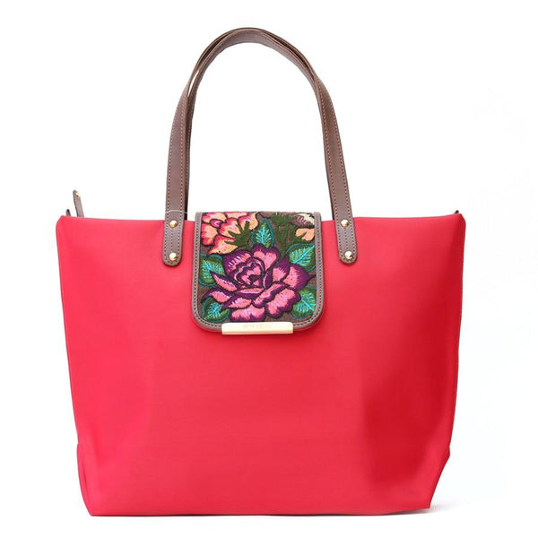Front view of Camelia red bag with handmade flower embroidery