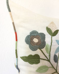 Mica Cenote Throw Pillow detail of flower embroidery
