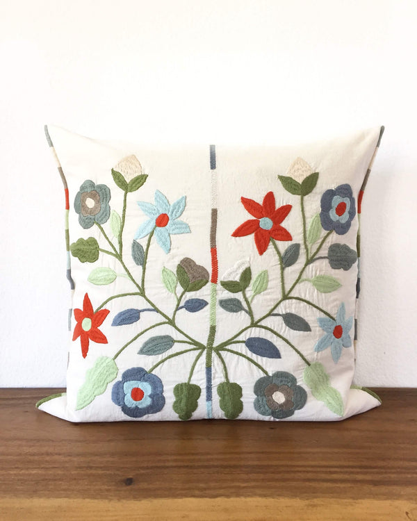 Mica Cenote Throw Pillow with embroidered flowers front view