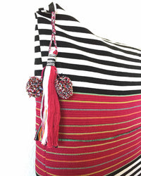 Nachig Lupe Throw Pillow black and white horizontal stripes with pink accent in middle detail view of tassel