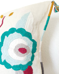 Decortive Pillow with hand embroidered flowers detail view