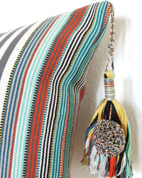 Decortive Pillow with grey & white stripes detail view of tassel