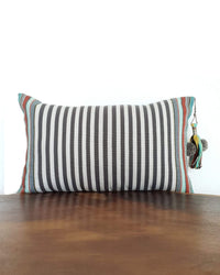 Decortive Pillow with grey & white stripes and a decorative tassel