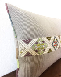 Universo Luna Throw Pillow light grey with brocades in pastel colors detail view of brocades